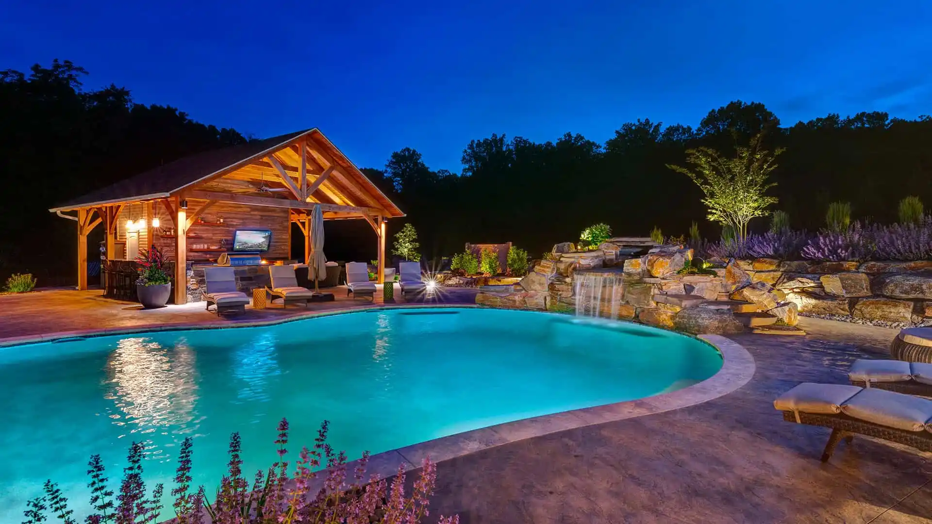 Custom natural stone patio with seat walls in Delaware County